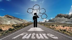 A figure standing on a road with the word 'Future' painted on it, surrounded by thought bubbles against a backdrop of a blue sky and mountains.